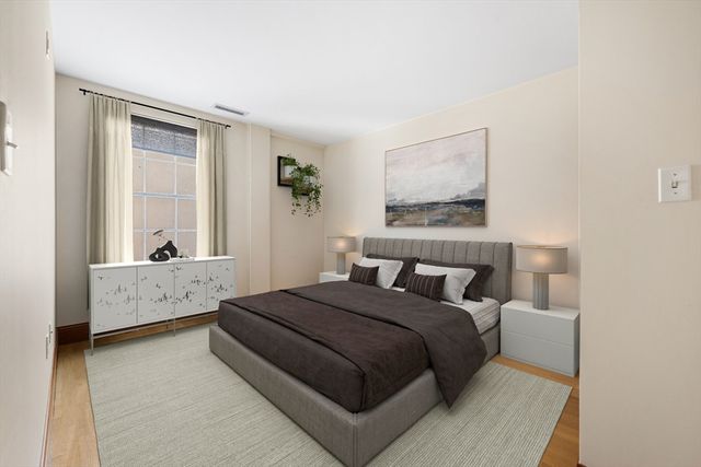 a bed room with a bed and a window