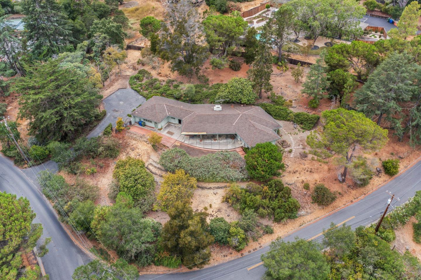 an aerial view of residential houses with outdoor space