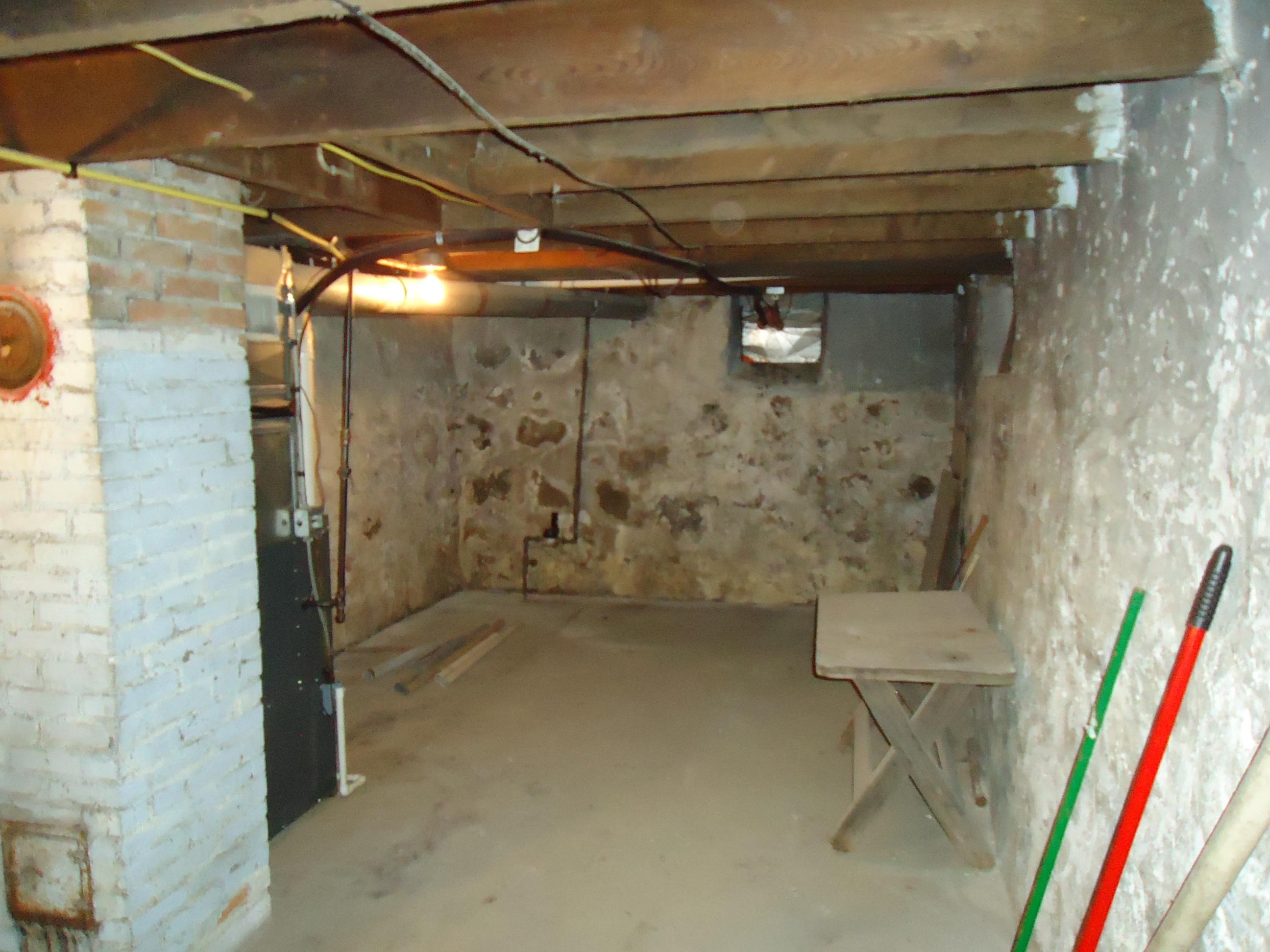 17 3rd Street Southeast Chisholm, MN 55719 - Photo 15 of 28 Unfinished below grade area with heating unit