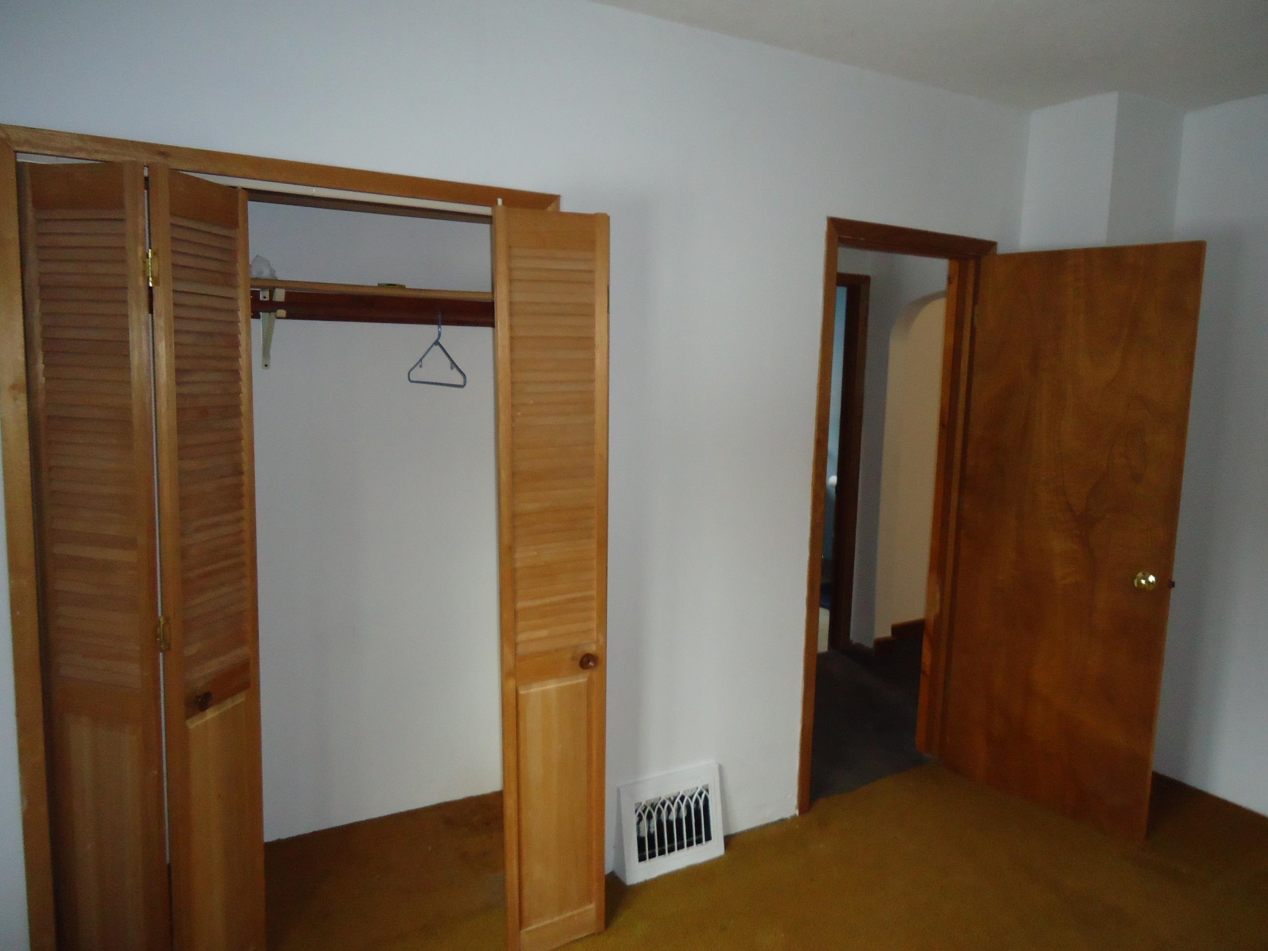 17 3rd Street Southeast Chisholm, MN 55719 - Photo 8 of 28 Unfurnished bedroom featuring a closet