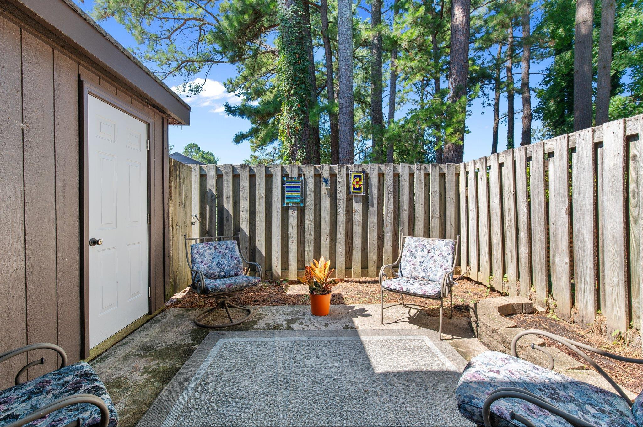 1209 Manassas Court, Unit B Raleigh, NC 27609 - Photo 17 of 34 a backyard of a house with outdoor seating