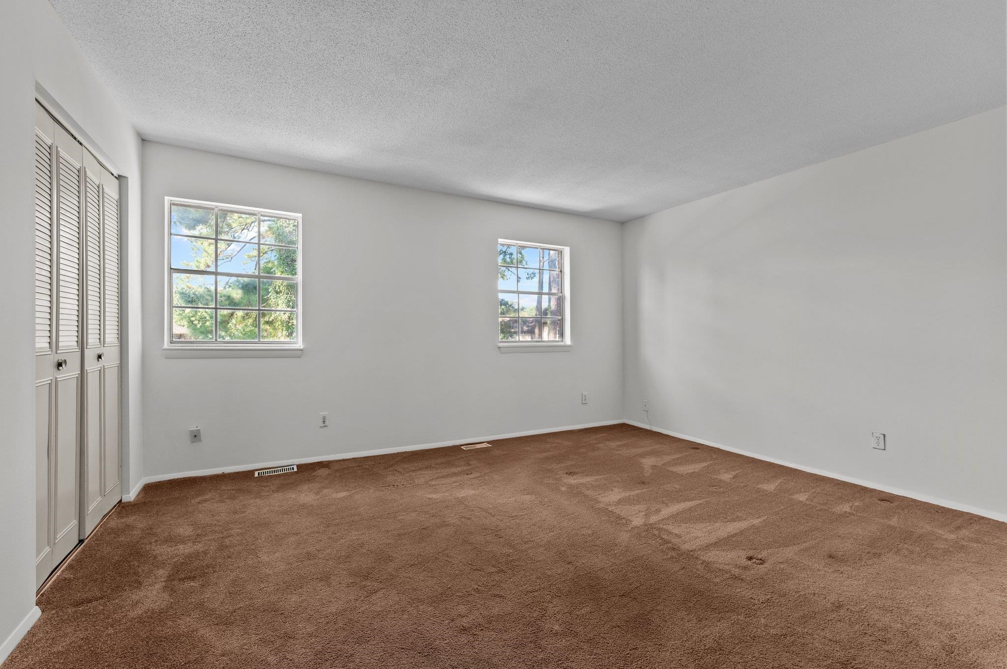 1209 Manassas Court, Unit B Raleigh, NC 27609 - Photo 19 of 34 an empty room with windows