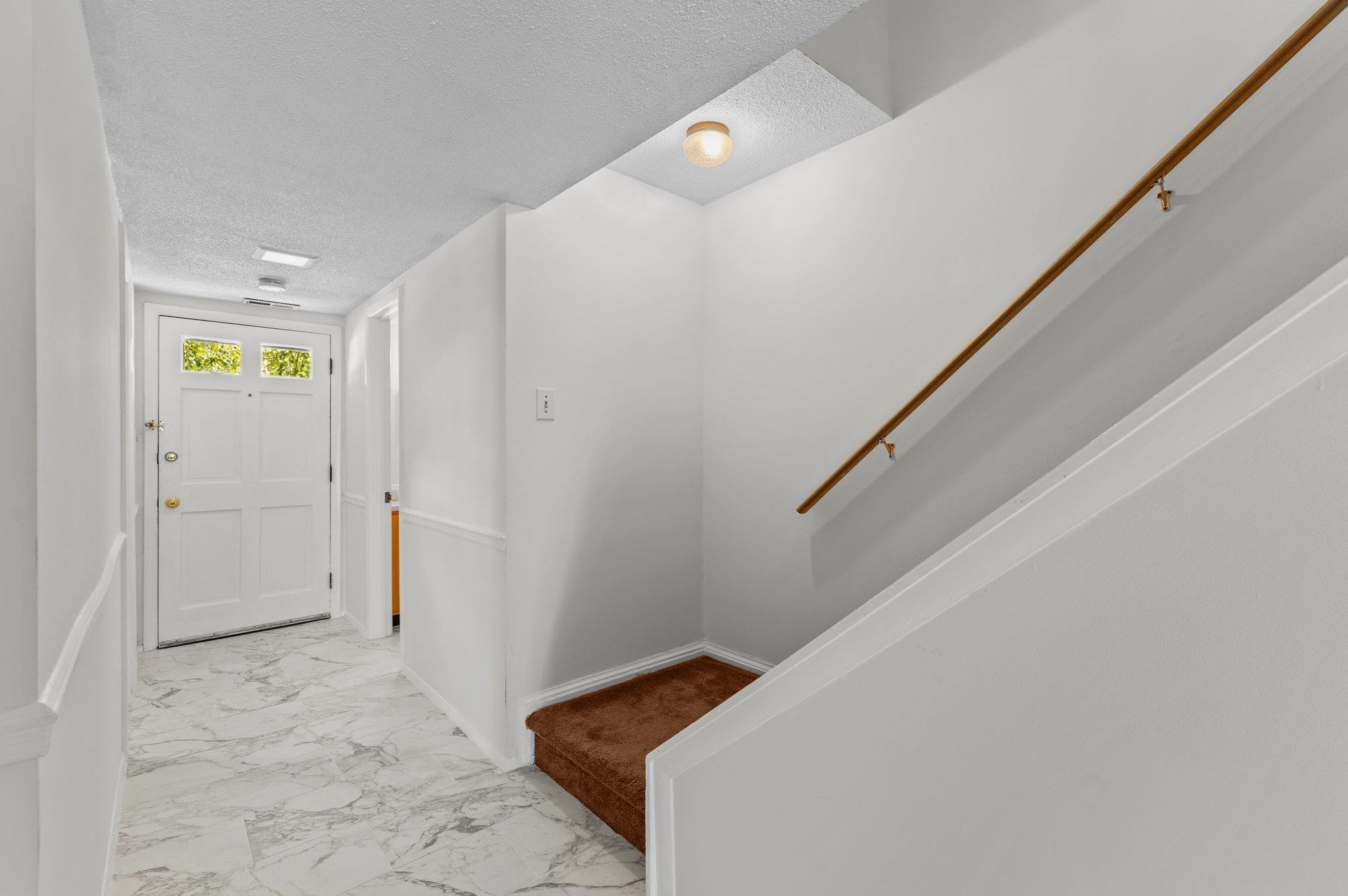 1209 Manassas Court, Unit B Raleigh, NC 27609 - Photo 6 of 34 a view of hallway with hallway and stairs