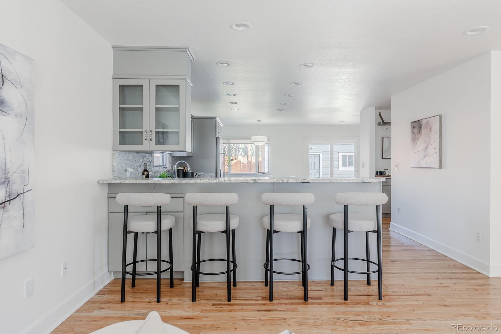 1835 Columbine Avenue Boulder, CO 80302 - Photo 11 of 40 a dining hall with stainless steel appliances kitchen island granite countertop a dining table chairs and a refrigerator