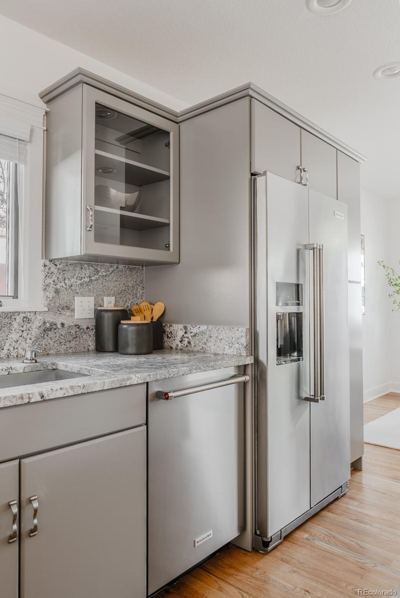 1835 Columbine Avenue Boulder, CO 80302 - Photo 13 of 40 a kitchen with stainless steel appliances granite countertop a refrigerator and a sink