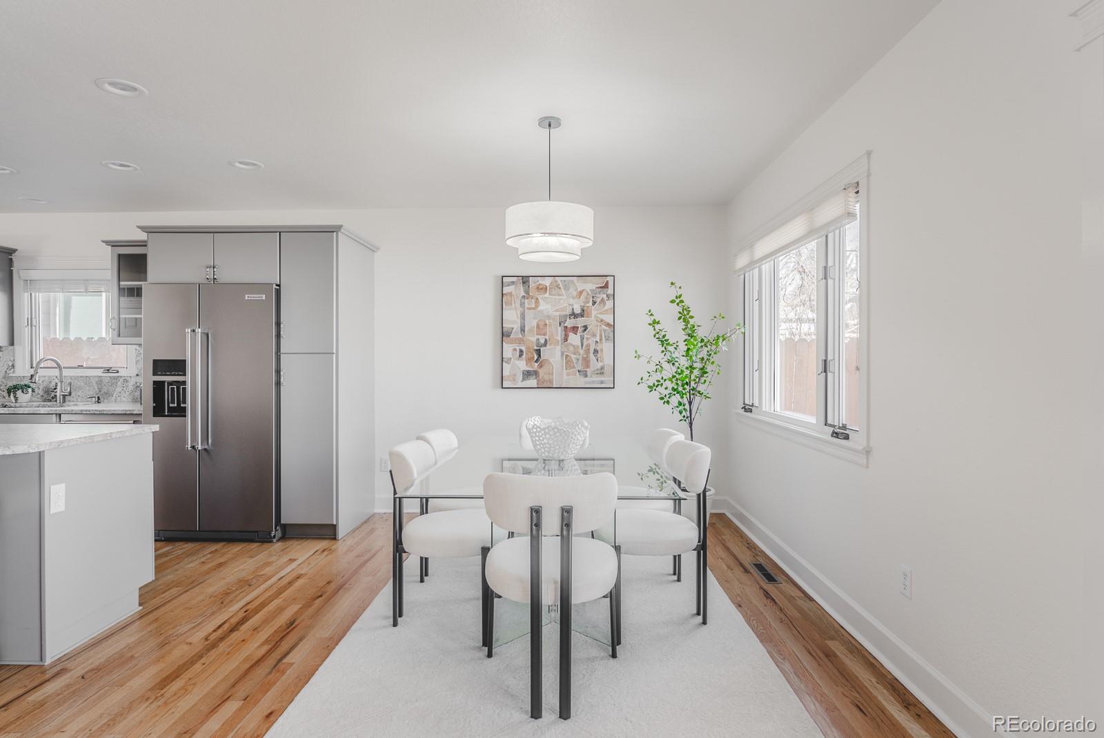 1835 Columbine Avenue Boulder, CO 80302 - Photo 15 of 40 a dining room with furniture a chandelier and wooden floor