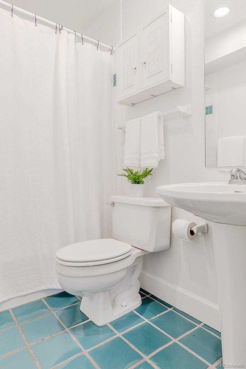 1835 Columbine Avenue Boulder, CO 80302 - Photo 20 of 40 a bathroom with a sink toilet and a mirror