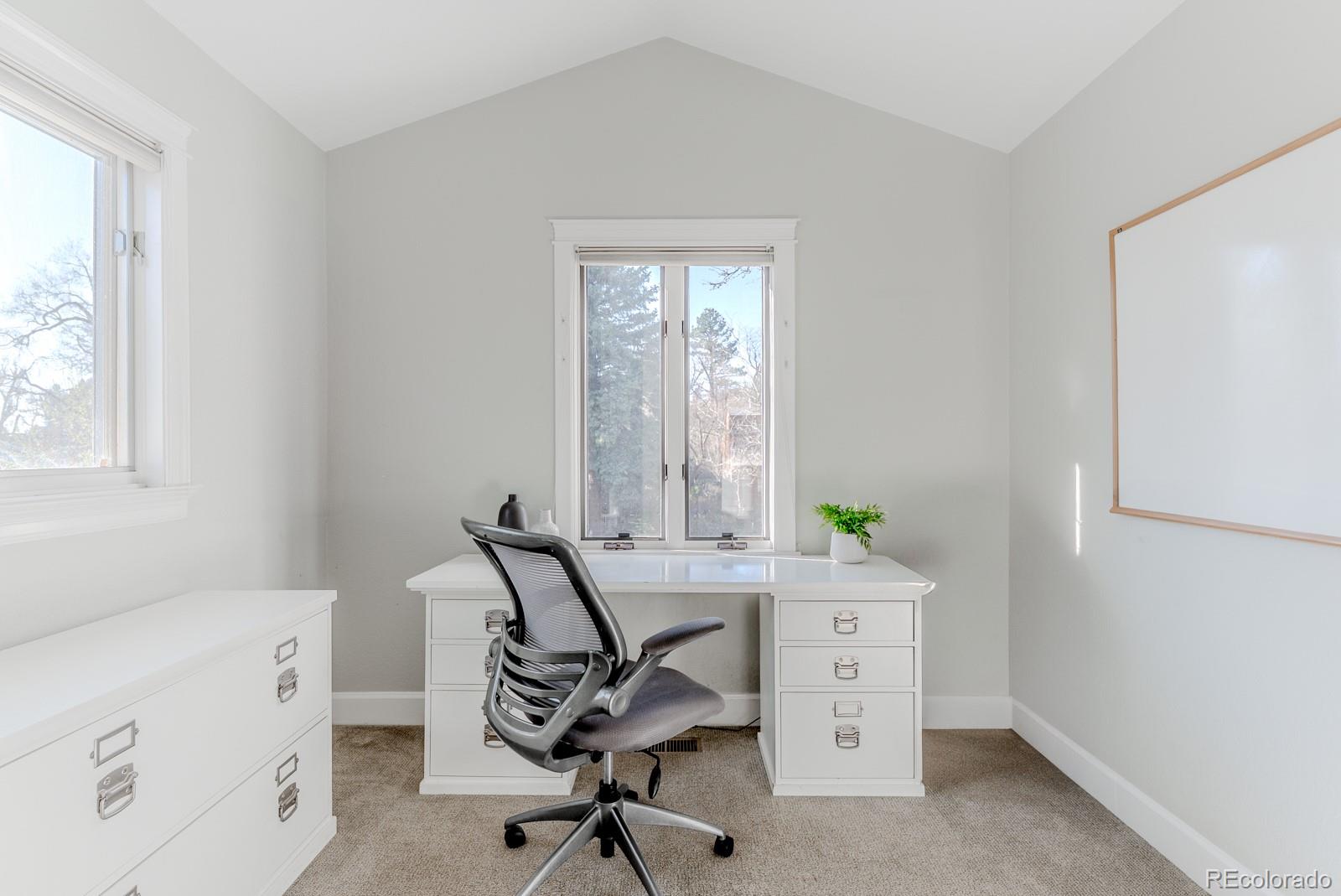 1835 Columbine Avenue Boulder, CO 80302 - Photo 33 of 40 a view of a workspace with furniture and a window