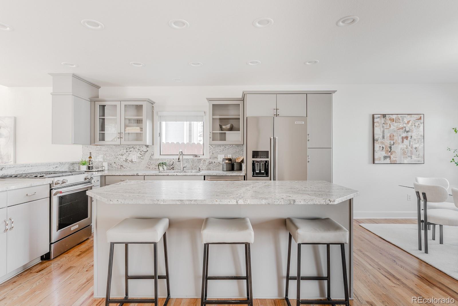 1835 Columbine Avenue Boulder, CO 80302 - Photo 9 of 40 a kitchen with stainless steel appliances granite countertop a stove a sink and a refrigerator