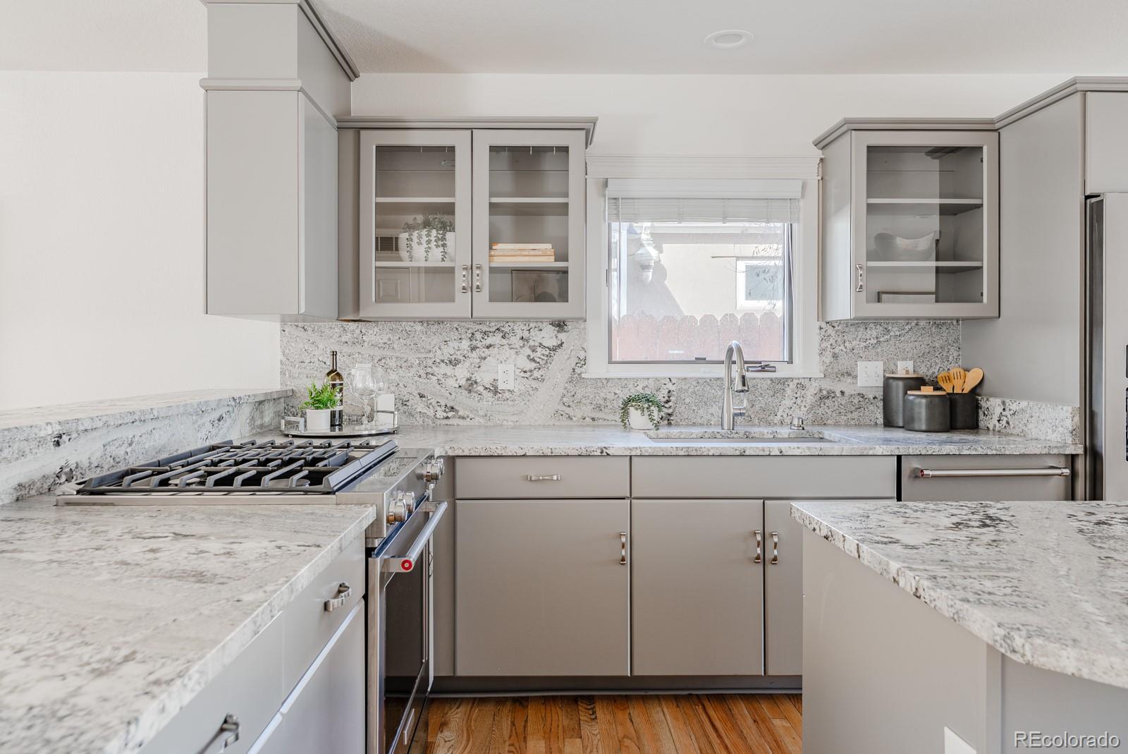 1835 Columbine Avenue Boulder, CO 80302 - Photo 10 of 40 a kitchen with stainless steel appliances granite countertop a sink stove and cabinets