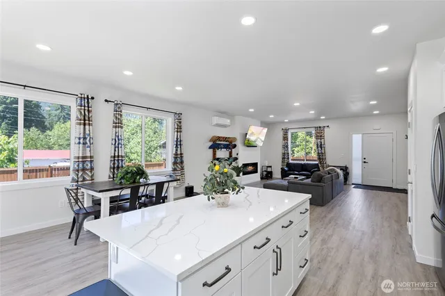 a view of a dining room with furniture window and wooden floor