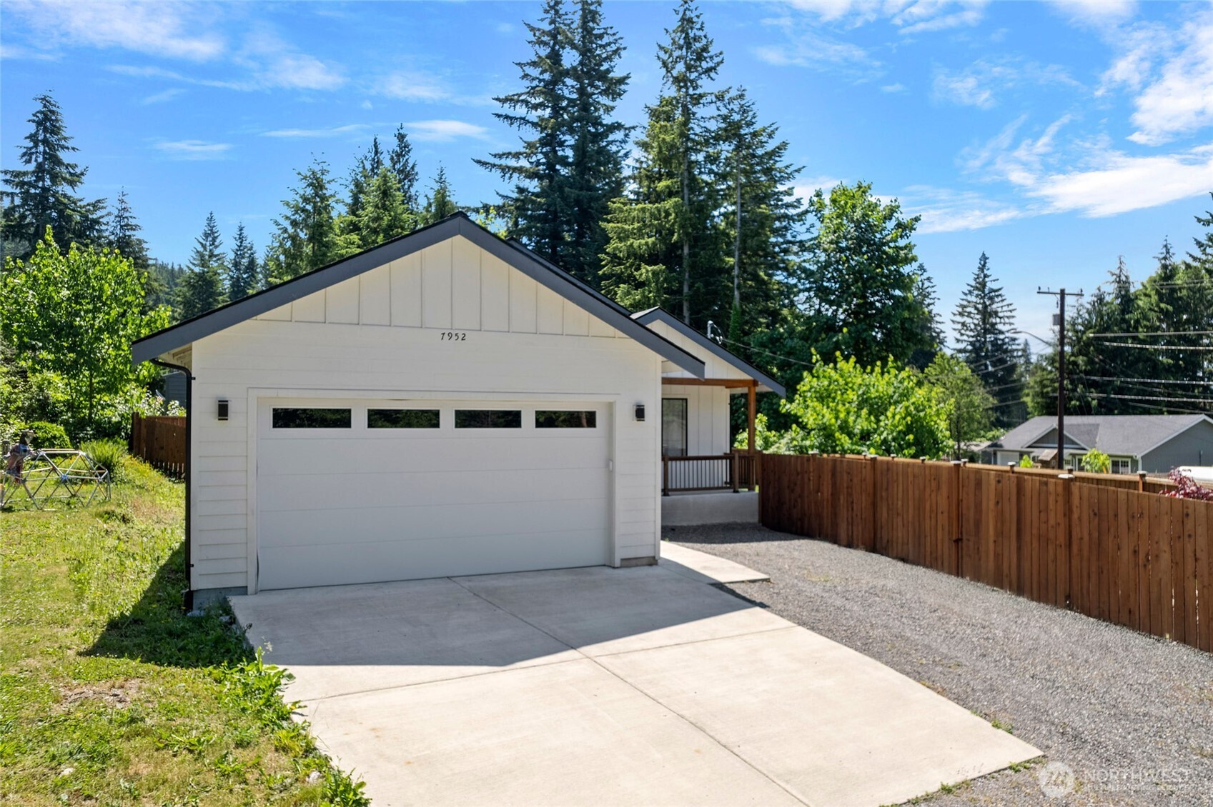 7952 Apache Drive Maple Falls, WA 98266 - Photo 27 of 28 a view of a white house with a small yard and wooden fence