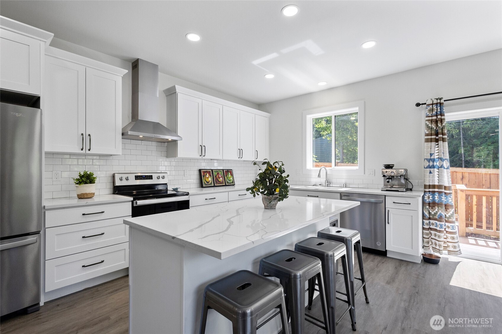 7952 Apache Drive Maple Falls, WA 98266 - Photo 7 of 28 a kitchen with white cabinets and white appliances