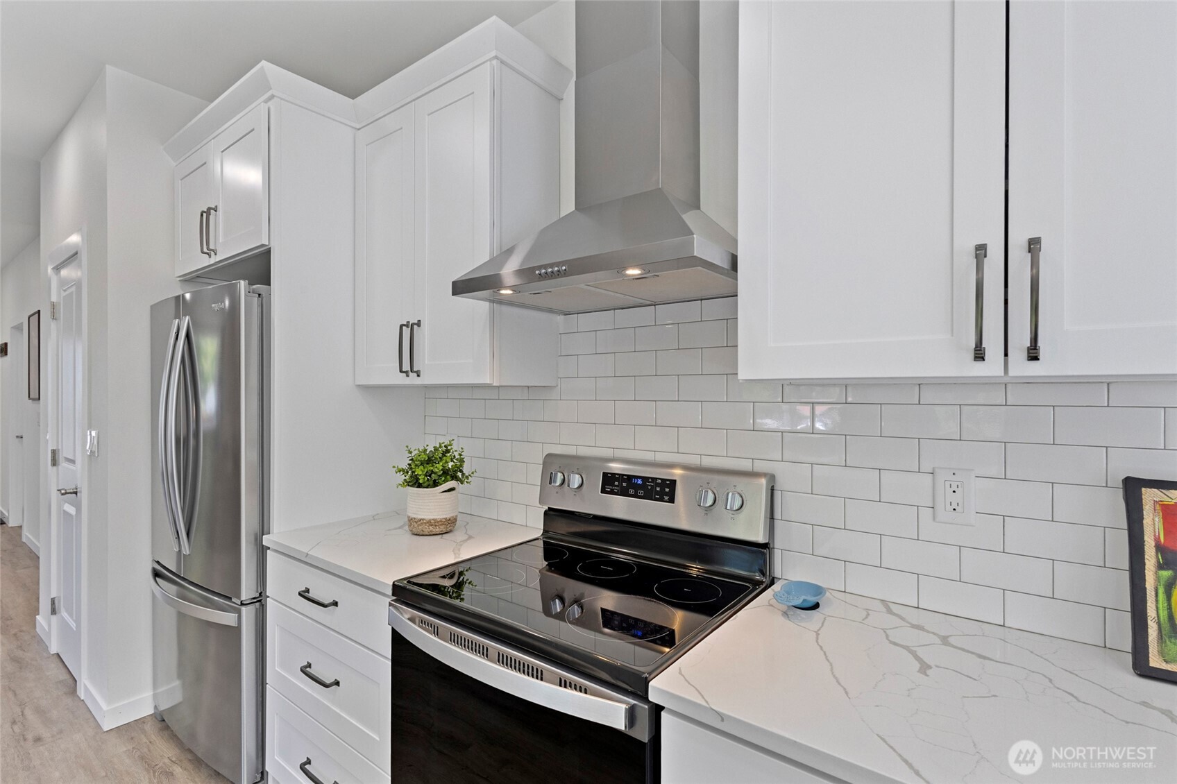 7952 Apache Drive Maple Falls, WA 98266 - Photo 10 of 28 a kitchen with white cabinets and appliances