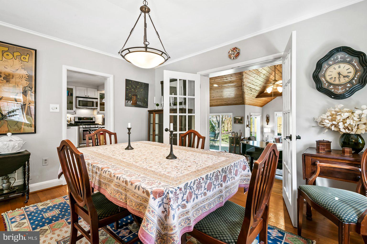 620 Overbrook Road Baltimore, MD 21212 - Photo 14 of 53 a view of a dining room with furniture a chandelier and wooden floor