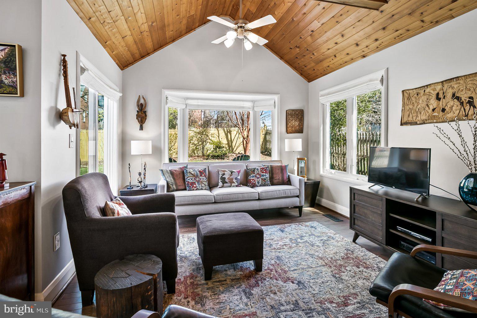 620 Overbrook Road Baltimore, MD 21212 - Photo 24 of 53 a living room with furniture a flat screen tv and a large window