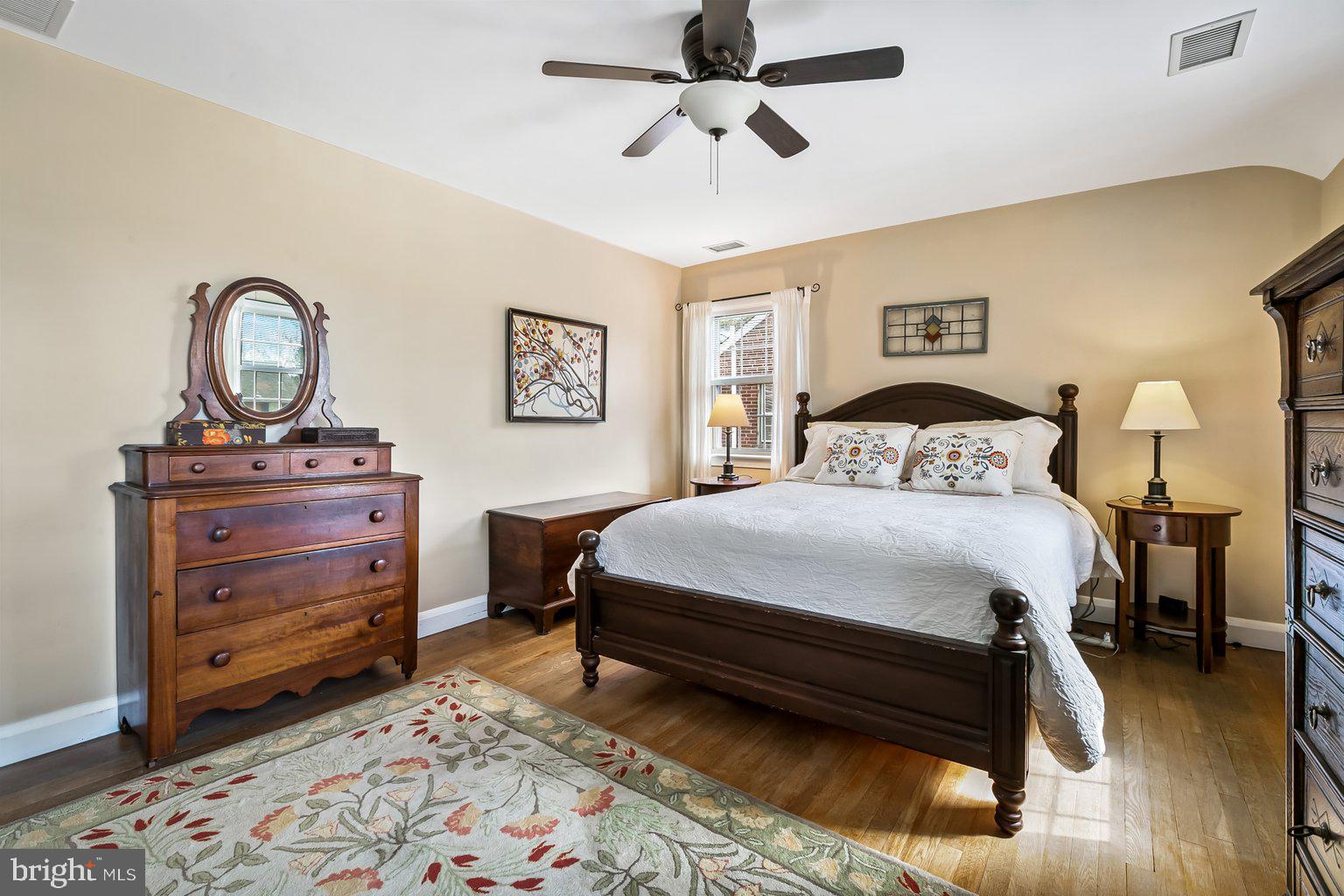 620 Overbrook Road Baltimore, MD 21212 - Photo 37 of 53 a bedroom with a bed and a chandelier