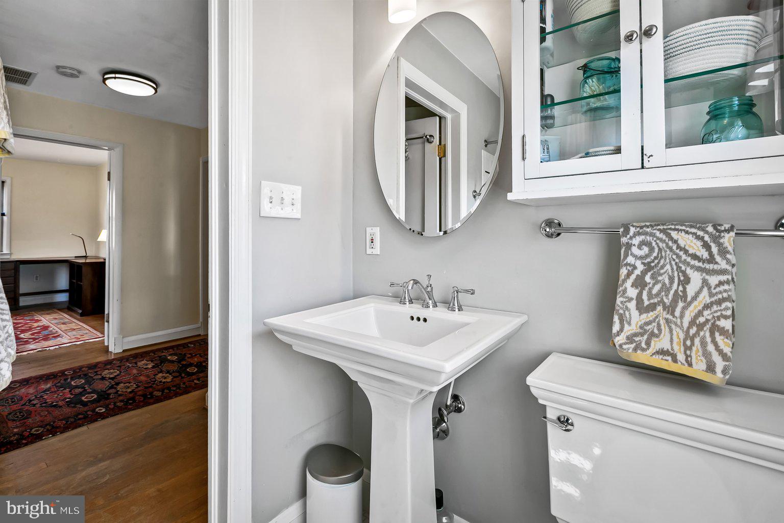 620 Overbrook Road Baltimore, MD 21212 - Photo 43 of 53 a bathroom with a sink and a mirror