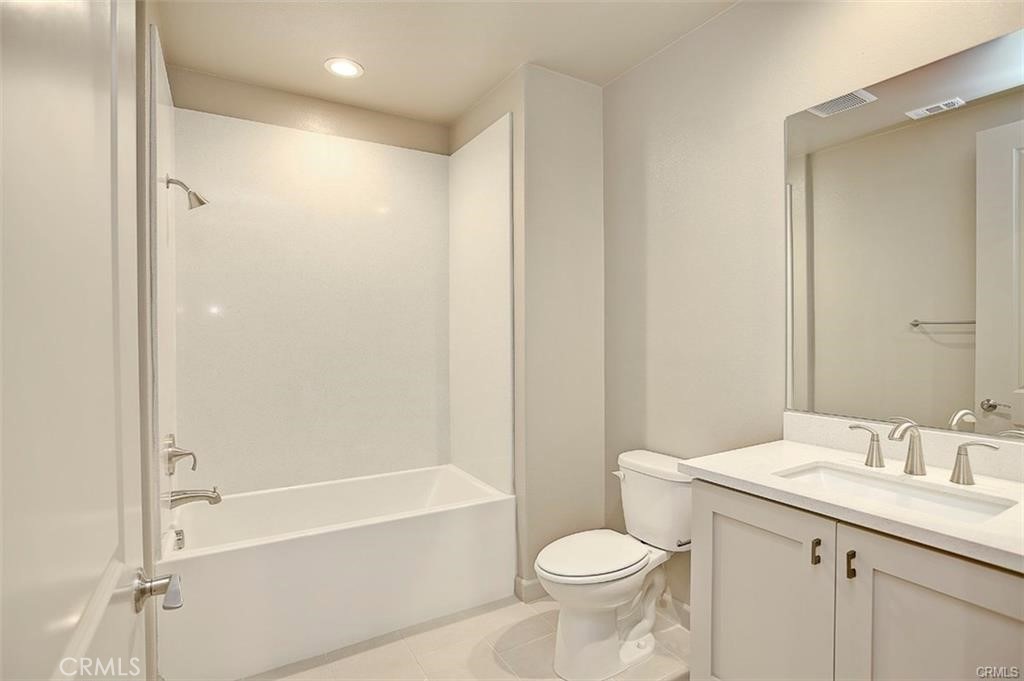 115 Fixie Irvine, CA 92618 - Photo 26 of 29 a bathroom with a granite countertop sink toilet and shower