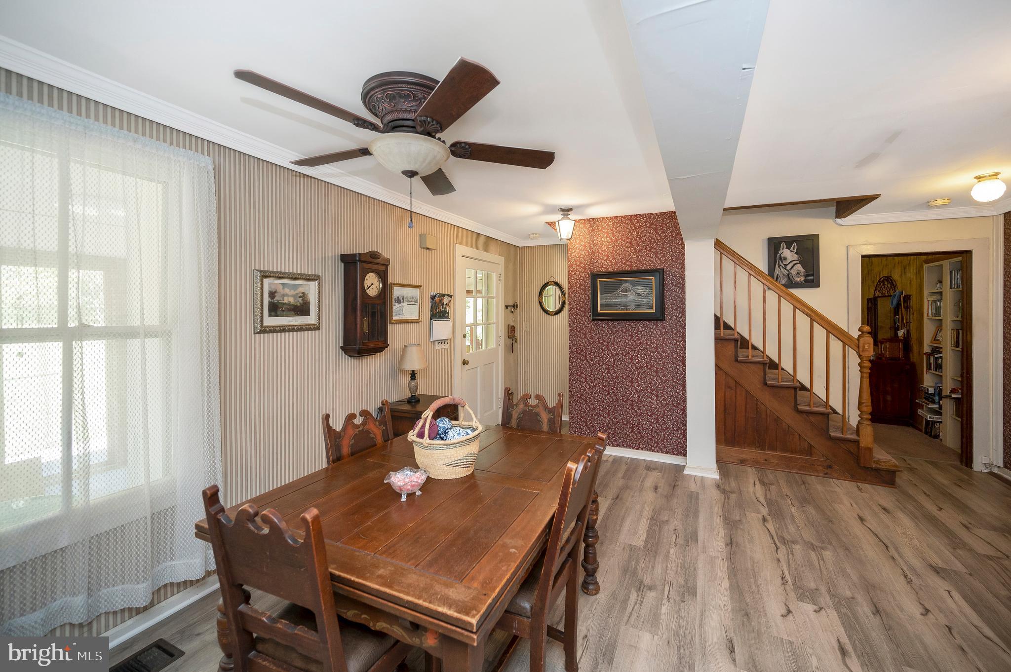 31934 Indiantown Road Locust Grove, VA 22508 - Photo 11 of 60 a view of a dining room with furniture window and wooden floor