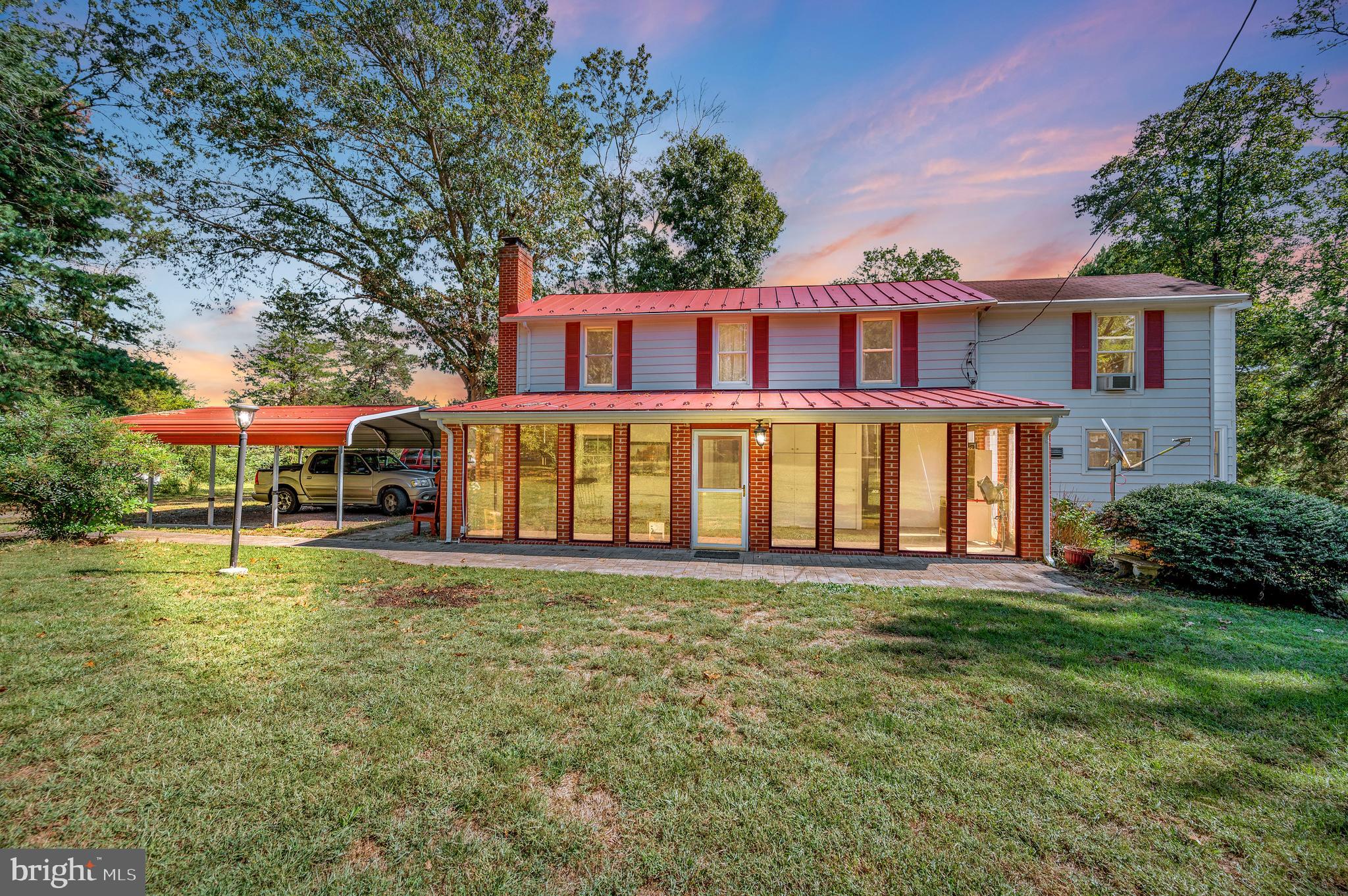31934 Indiantown Road Locust Grove, VA 22508 - Photo 2 of 60 a view of a house with a yard balcony and sitting area