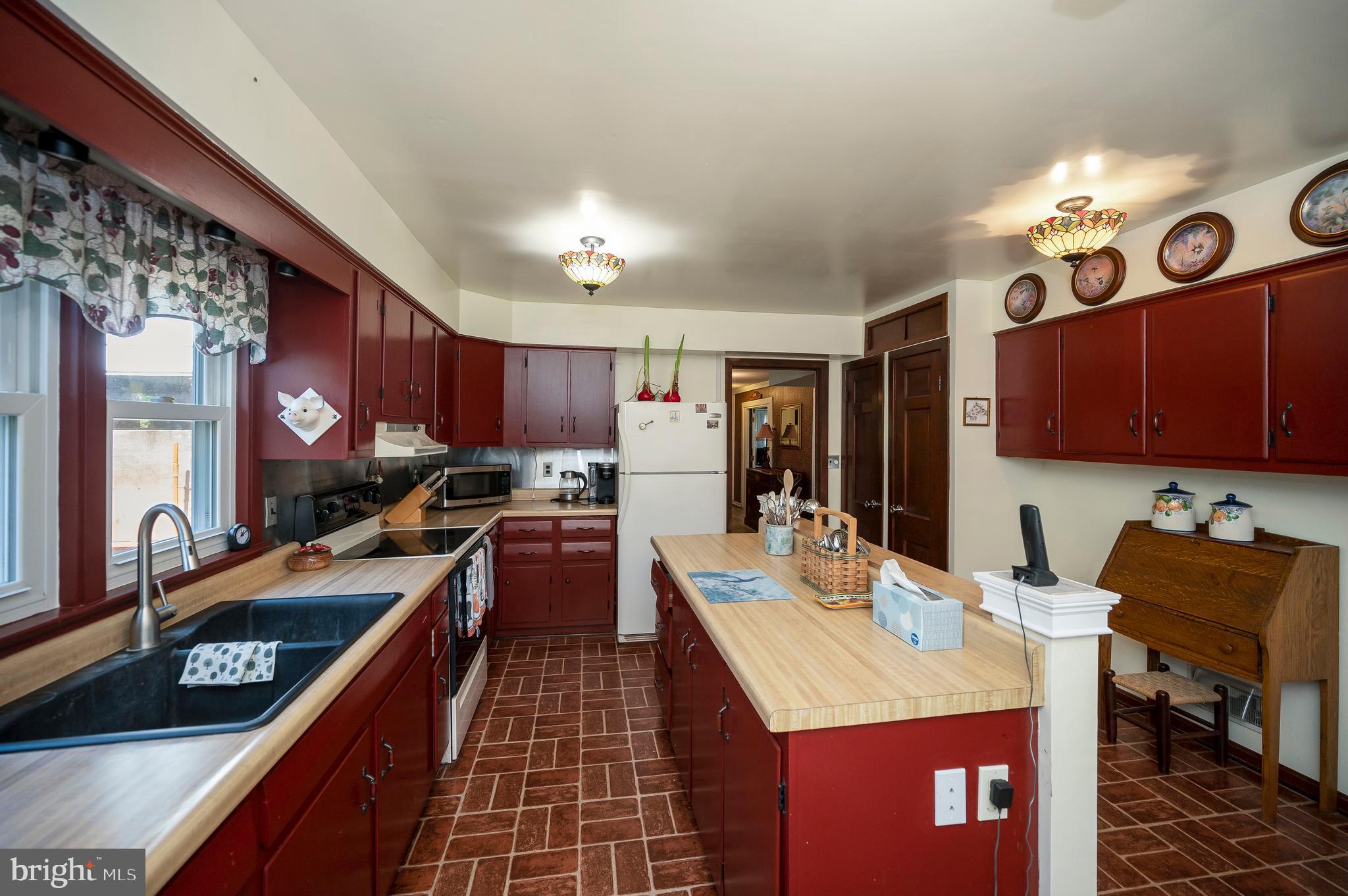 31934 Indiantown Road Locust Grove, VA 22508 - Photo 21 of 60 a kitchen with stainless steel appliances kitchen island granite countertop a stove a sink dishwasher and cabinets with wooden floor