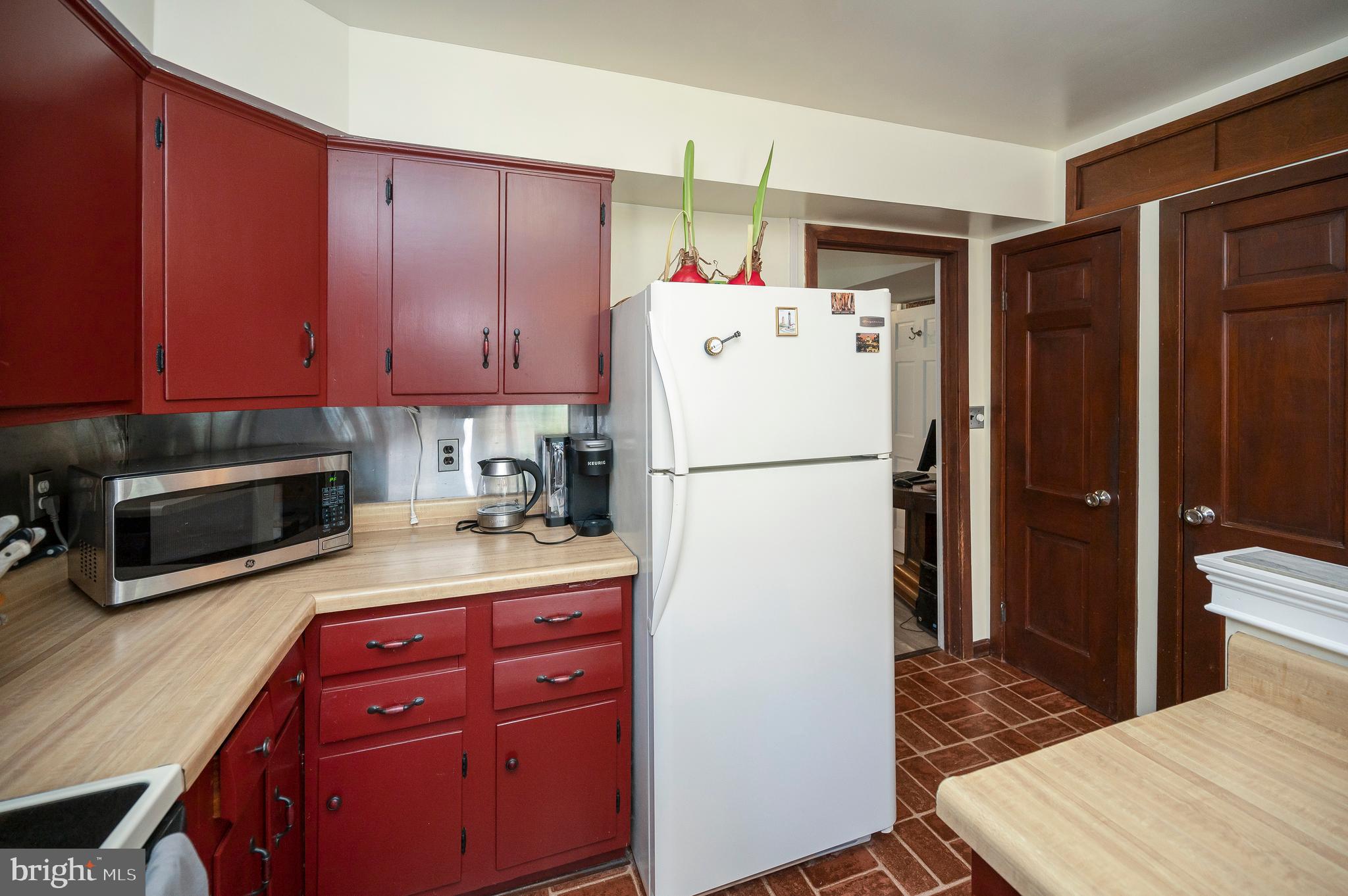 31934 Indiantown Road Locust Grove, VA 22508 - Photo 23 of 60 a kitchen with a refrigerator sink and cabinets