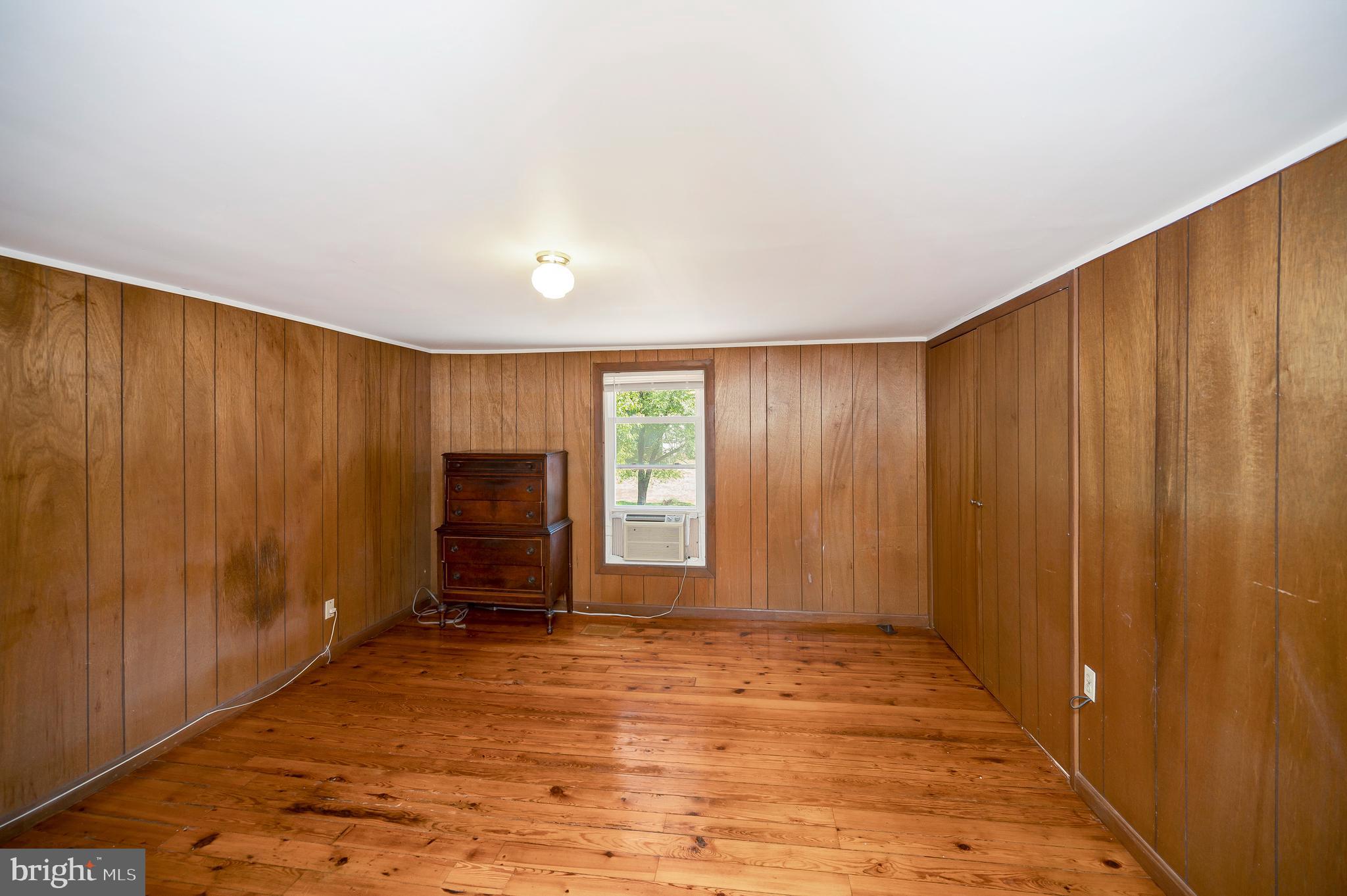 31934 Indiantown Road Locust Grove, VA 22508 - Photo 30 of 60 a view of an empty room with wooden floor and a window