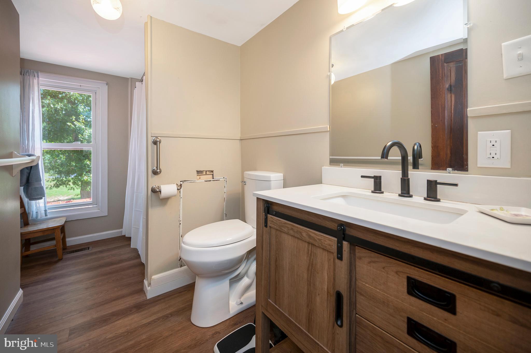 31934 Indiantown Road Locust Grove, VA 22508 - Photo 32 of 60 a bathroom with a sink toilet and a window