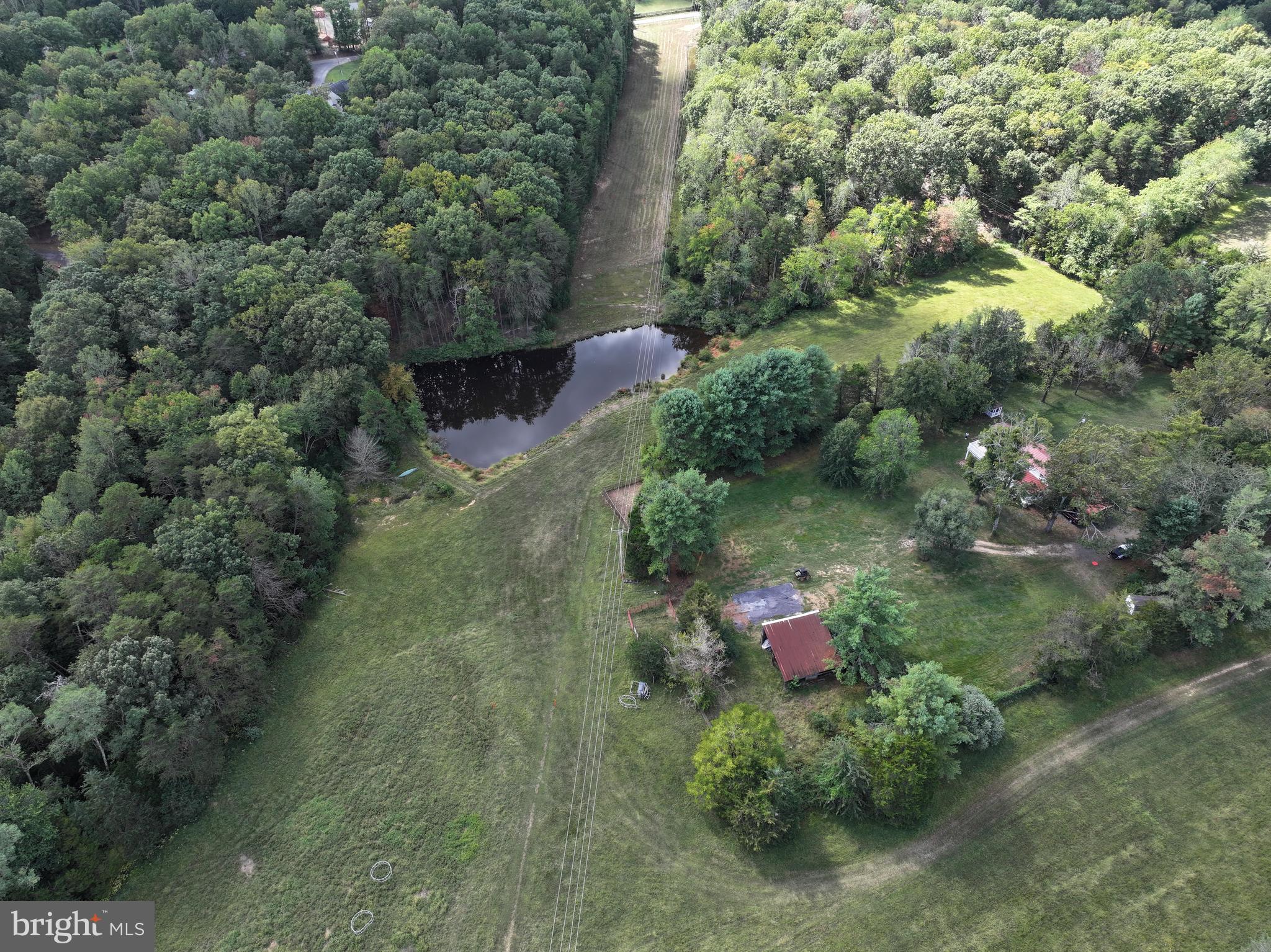 31934 Indiantown Road Locust Grove, VA 22508 - Photo 51 of 60 an aerial view of residential house with outdoor space and trees all around