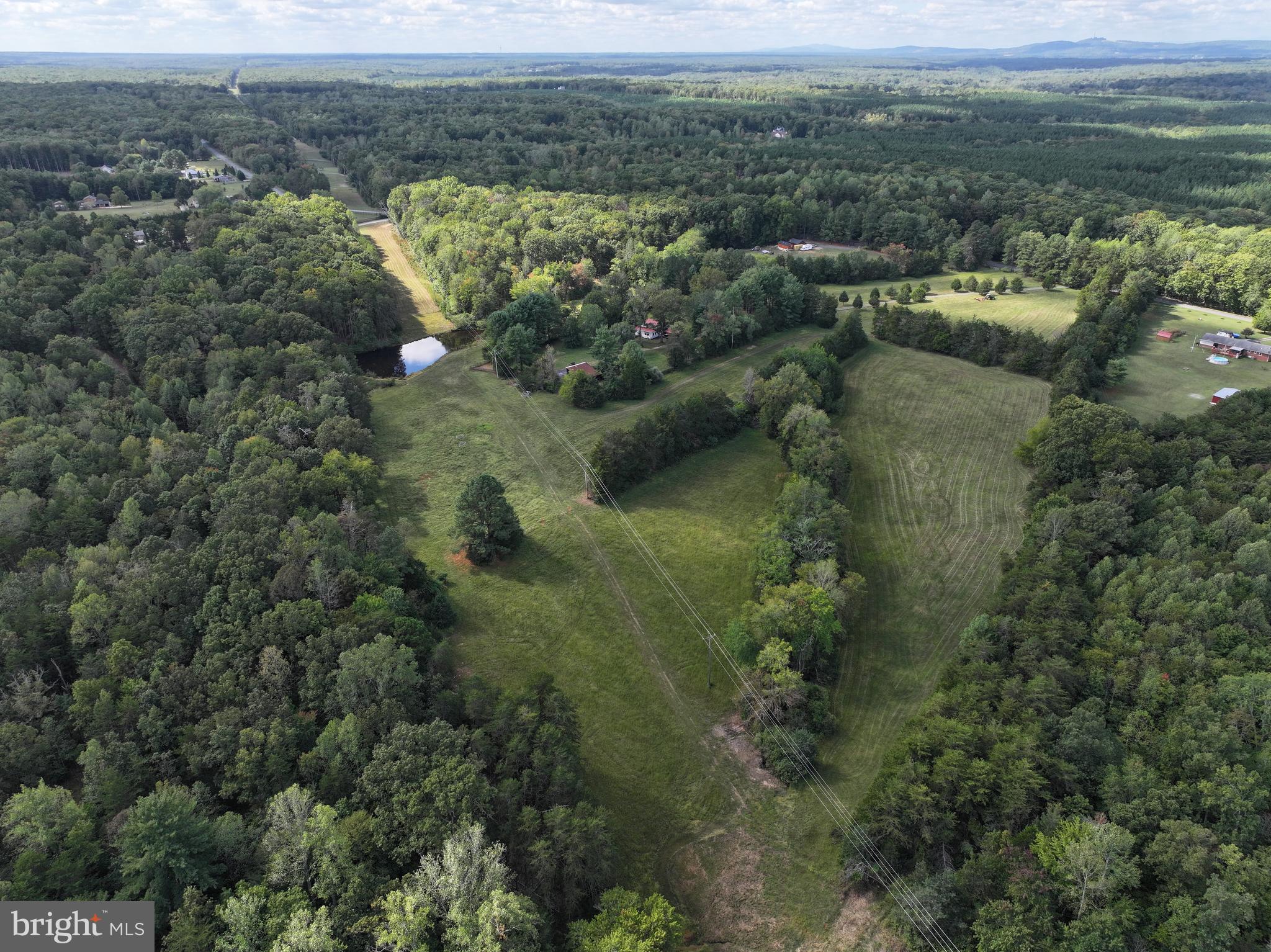 31934 Indiantown Road Locust Grove, VA 22508 - Photo 55 of 60 an aerial view of residential houses with outdoor space and trees