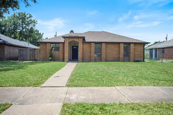 a view of house with yard and green space