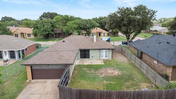 aerial view of house with yard