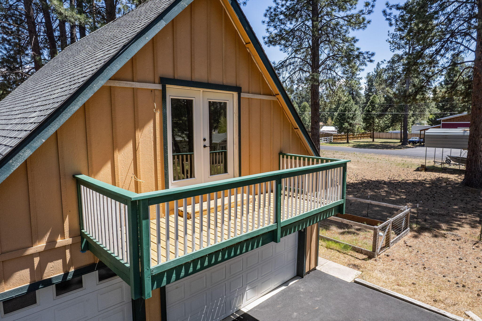 59842 Navajo Road Bend, OR 97702 - Photo 47 of 52 a view of a house with backyard and sitting area