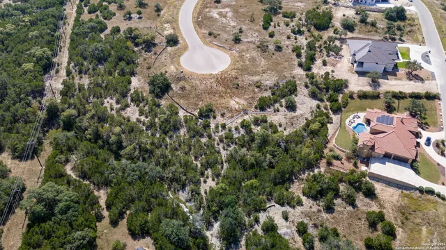 an aerial view of a house with a yard