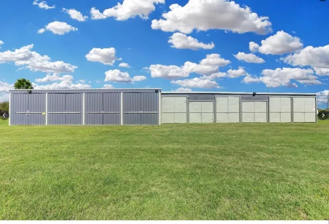 a view of a house with a big yard