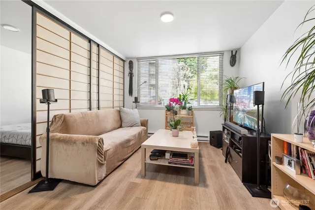 a kitchen with stainless steel appliances a sink a stove and a refrigerator