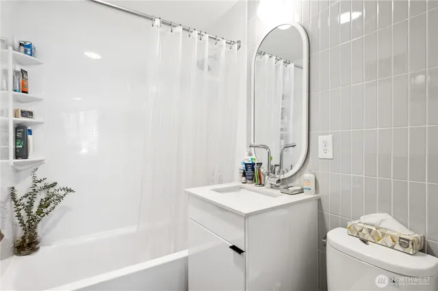 a dining room with furniture a large window and a dining table