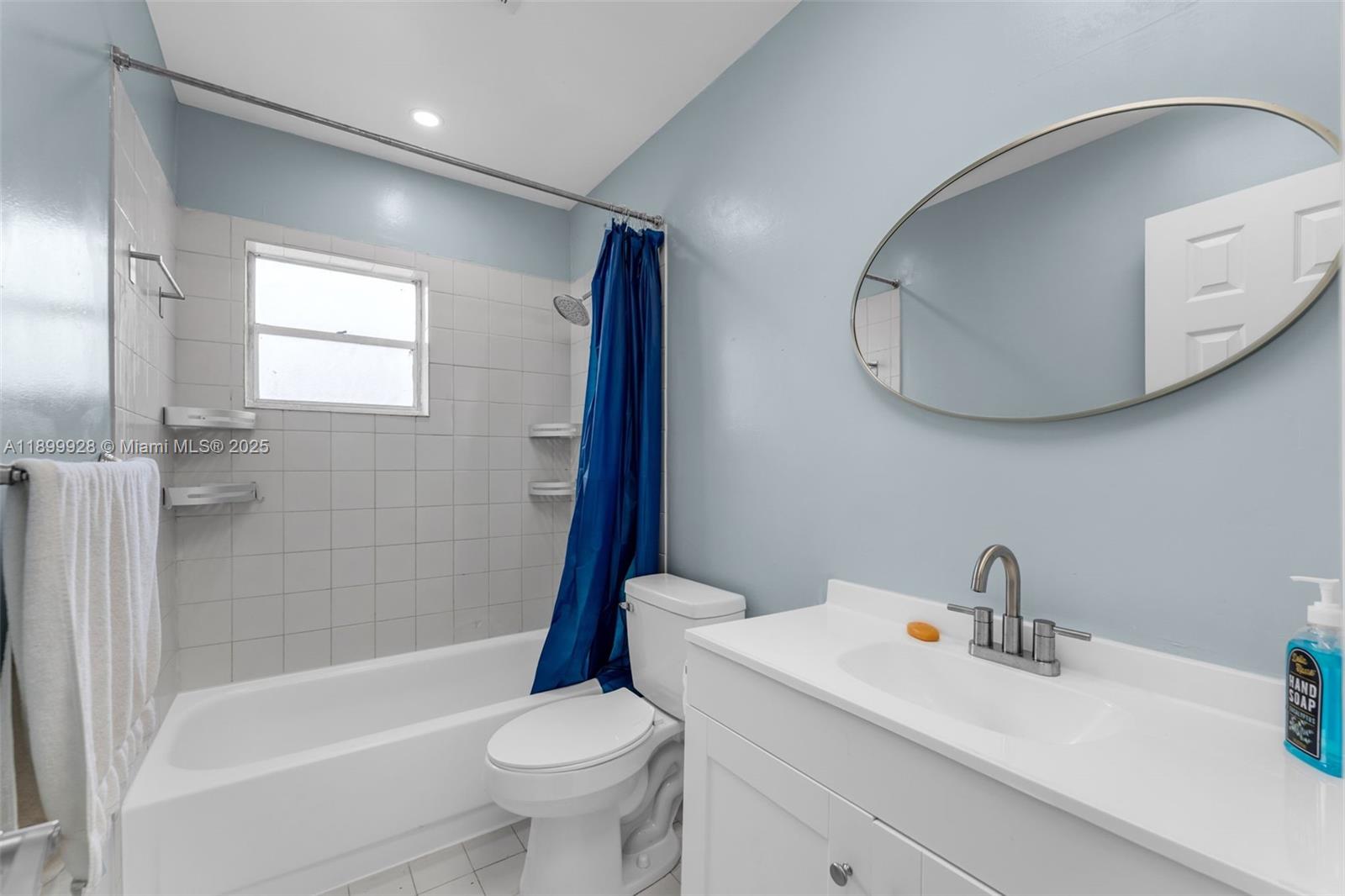12820 Southwest 43rd Drive, Unit 233B Miami, FL 33175 - Photo 11 of 22 a bathroom with a sink toilet and shower