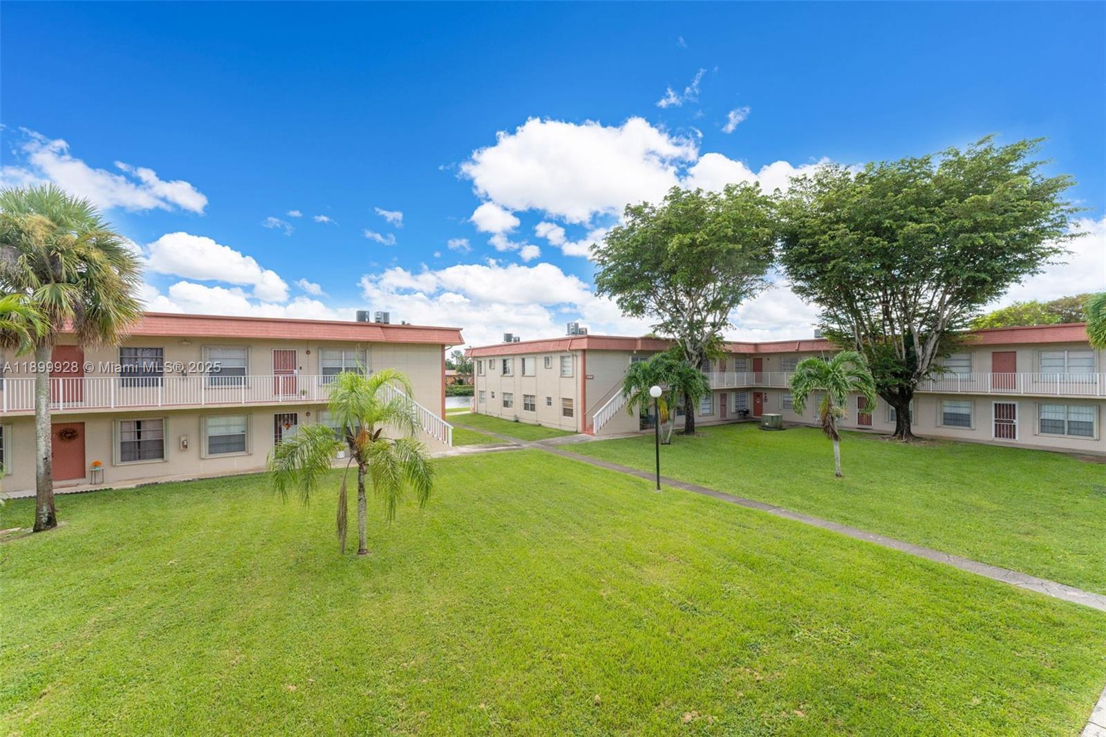 12820 Southwest 43rd Drive, Unit 233B Miami, FL 33175 - Photo 16 of 22 a view of a house with a backyard porch and sitting area