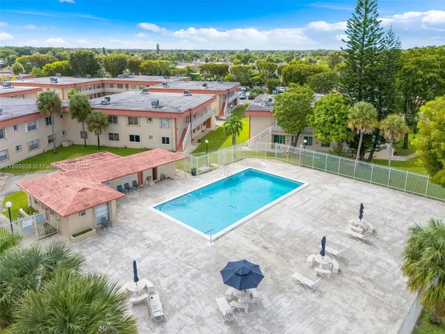 an aerial view of a houses with a lake view