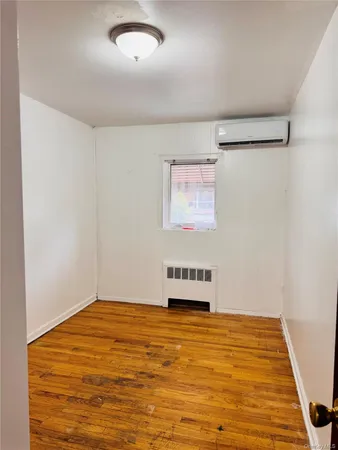 a room with a bed and a window