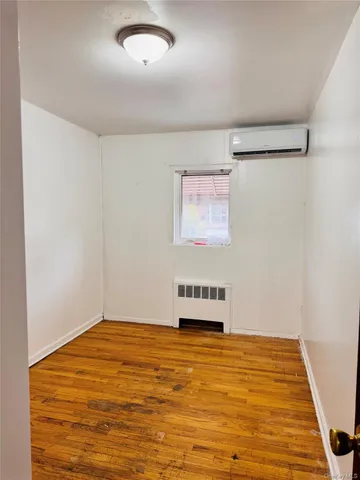 a room with a bed and a window