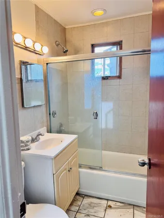 a bathroom with a sink a mirror and a bathtub
