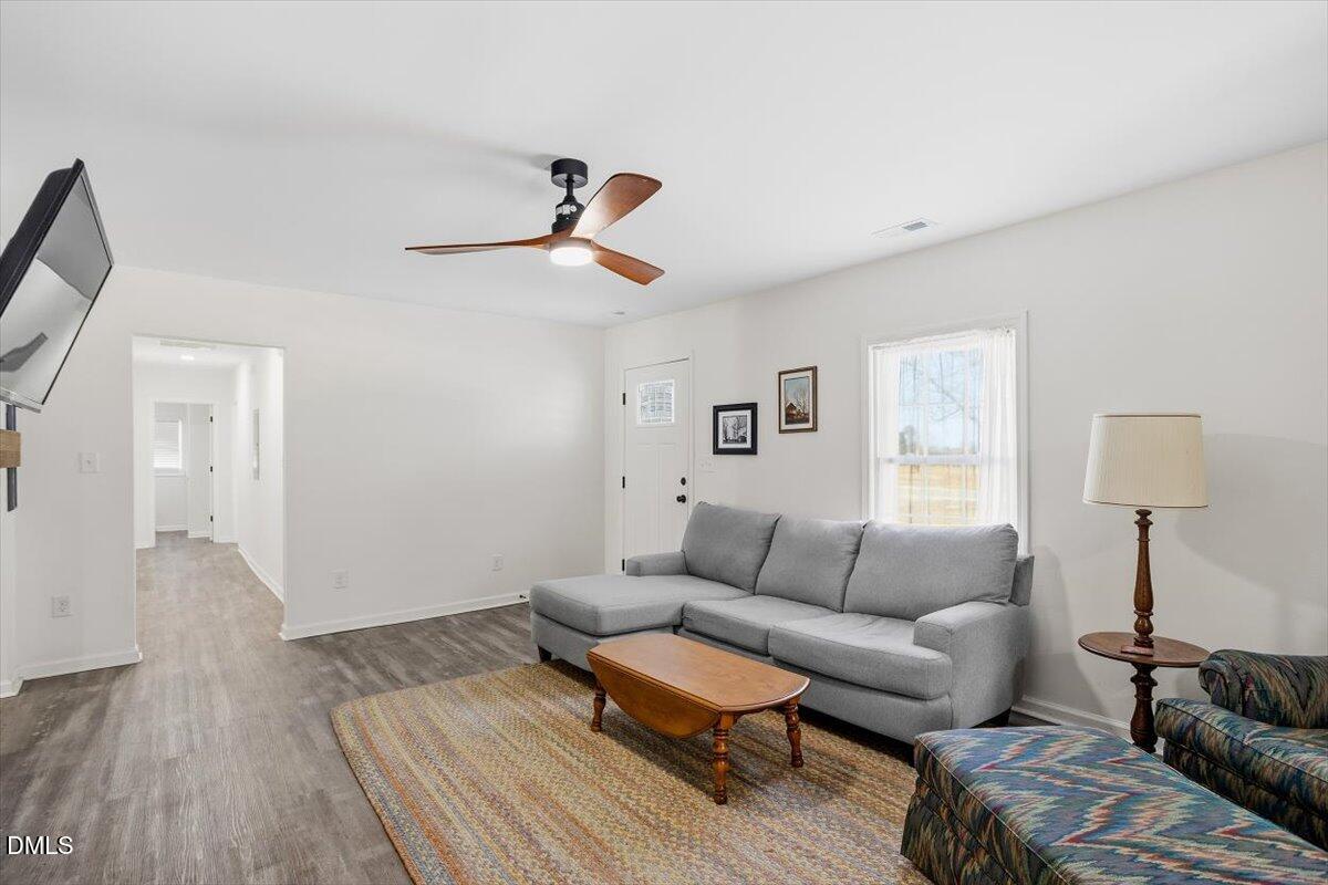 962 Laurel Mill-Centerville Road Louisburg, NC 27549 - Photo 10 of 31 a living room with furniture and a wooden floor