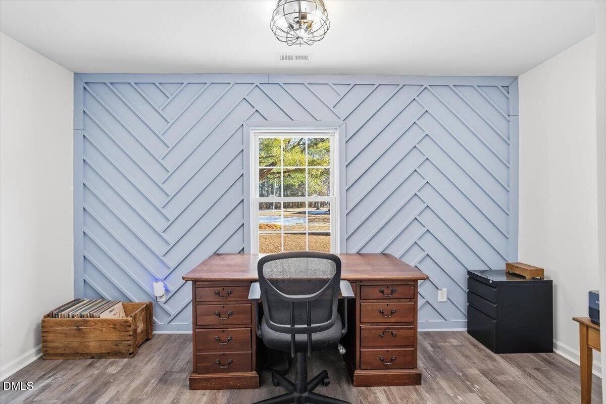 962 Laurel Mill-Centerville Road Louisburg, NC 27549 - Photo 4 of 31 a view of a workspace with furniture and a window