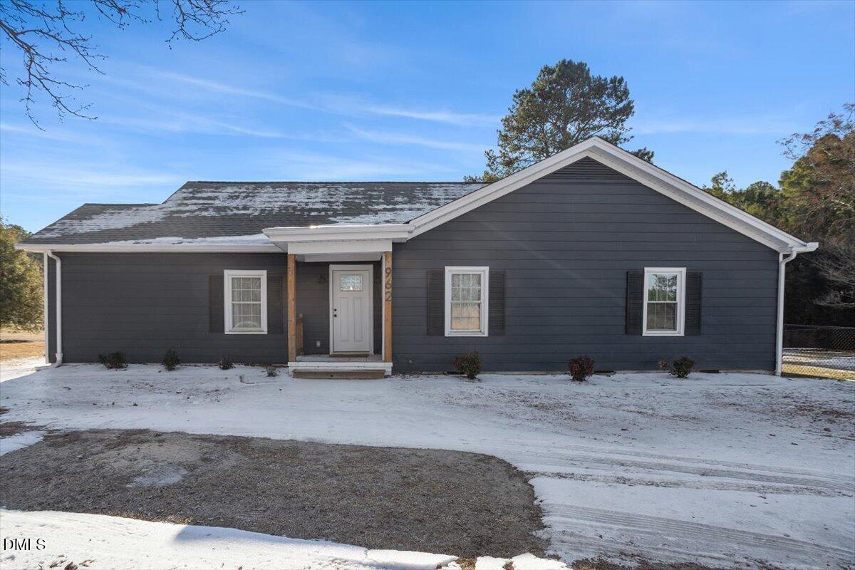 962 Laurel Mill-Centerville Road Louisburg, NC 27549 - Photo 5 of 31 a front view of a house with a yard