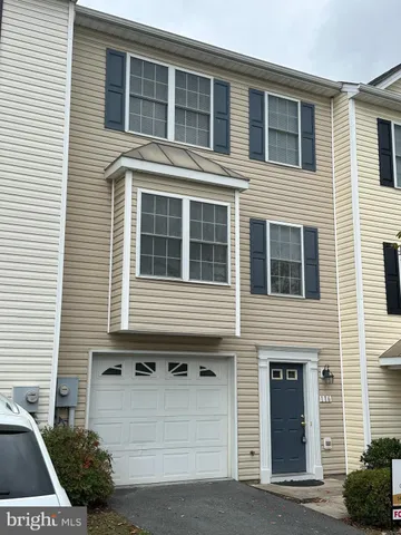 a front view of a house with garage