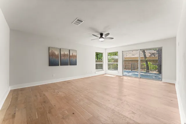 a view of an empty room with a window