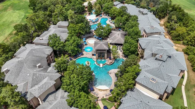 an aerial view of a house with a yard and garden